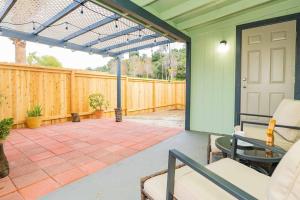 a patio with a wooden fence and a white door at Stylish 2B2B country style house in Glendora