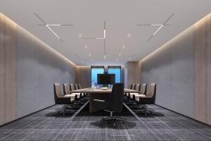 a conference room with a long table and chairs at Fairfield by Marriott Huai'an Downtown in Huai'an