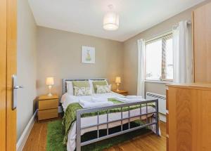 a small bedroom with a bed and a window at Oakwood Lodges in Skipwith