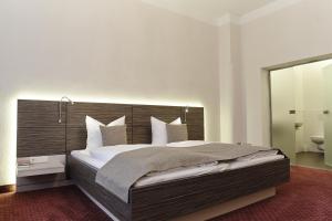 Postel nebo postele na pokoji v ubytování Hotel Prinzregent