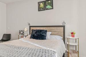 a bedroom with a bed with a blue pillow on it at Pure Relaxation-Luxury/Roof Top* in Philadelphia