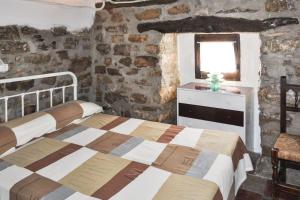 a bedroom with a bed and a window at Charming Villa in Montefrío with Private Pool in Montefrío +25 photos