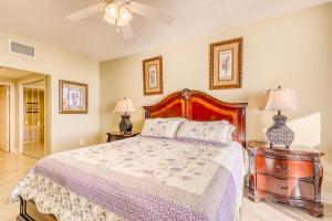 a bedroom with a bed and two night stands with lamps at Majestic Beach Resort Tower 2- 801 in Panama City Beach