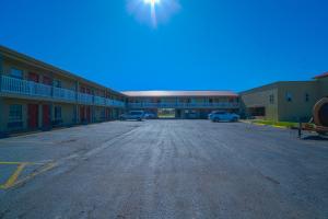 an empty parking lot in front of a motel at OYO Hotel Aransas Pass Corpus Christi TX-35 in Aransas Pass