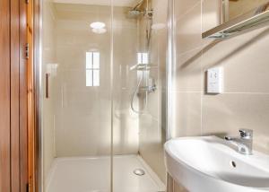 a bathroom with a shower and a sink at Hornsea Lakeside Lodges in Hornsea