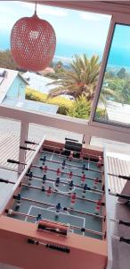 a foosball table with a view of the ocean at lilie97418 in La Plaine des Cafres