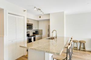 a kitchen with white walls and a marble counter top at Nauti Hideaway, Unit #2314 in Tavernier
