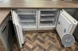 un réfrigérateur ouvert avec sa porte ouverte dans une cuisine dans l'établissement The Retreat 1 - Hot tub Lodge, pet friendly, WiFi & bed linen- Golden Palm Resort - Meadow Lakes Caravan & Lodge Hire, à Chapel St. Leonards 4 autres photos