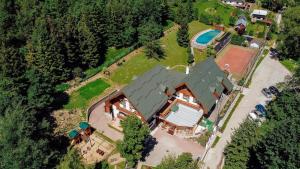 an overhead view of a large house with a pool at Hotel SEVERKA in Zákopčie