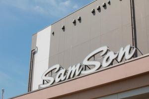 a sign on the side of a building at Samson Hotel in Hirado