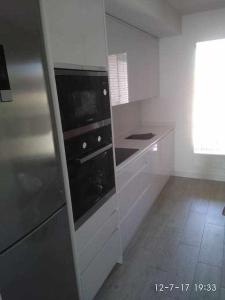 Kuchyň nebo kuchyňský kout v ubytování Nuevo apartamento en el centro, Parking incluido