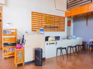 a room with a counter with stools and a counter at Charming Lipe Beach Resort in Ko Lipe