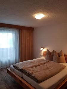 Posteľ alebo postele v izbe v ubytovaní Alpin Appart Reiterhof