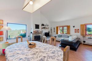 a living room with a table and a couch at Sierra Melides Villa,Alentejo, BR2 with private pool, BR3 with private pool - near beach in São Francisco da Serra