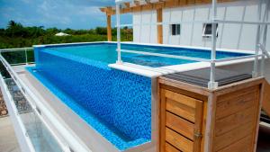 a swimming pool on the deck of a boat at Hotel Capriccio Mare y Restaurante in Punta Cana