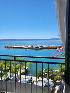 a balcony with a view of the ocean and a marina at Apartment Milena in Drasnice