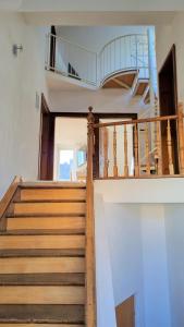 a staircase in a house with wooden steps at SchönZeit in Limburg an der Lahn
