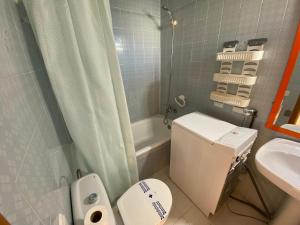 a small bathroom with a toilet and a sink at Valentina Platja in Sant Antoni de Calonge +24 photos