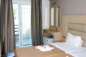 Postel nebo postele na pokoji v ubytování Rachoni Resort