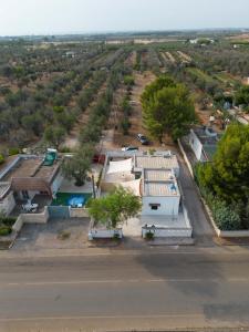 an aerial view of a house with a parking lot at Bilocale Camilla in villa salento in Sant'Isidoro