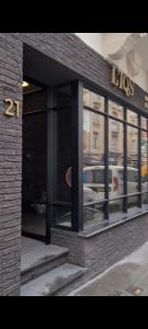 a store front of a building with a lot of windows at IQS Rooms - Chambre double avec salle de bain in Luxembourg