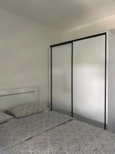a bedroom with a bed with a large metal headboard at Apartment in Lokva Rogoznica with sea view, balcony, air conditioning, WiFi 5118-4 in Lokva Rogoznica