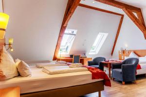 Postel nebo postele na pokoji v ubytování Bodensee-Hotel Kreuz