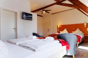 Postel nebo postele na pokoji v ubytování Bodensee-Hotel Kreuz