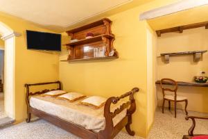 A bed or beds in a room at Grillo Rosso 5