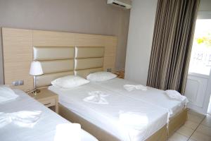 Postel nebo postele na pokoji v ubytování Rachoni Resort