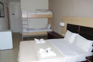Postel nebo postele na pokoji v ubytování Rachoni Resort