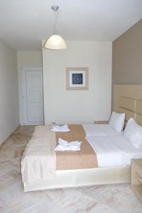 Postel nebo postele na pokoji v ubytování Rachoni Resort