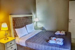 Postel nebo postele na pokoji v ubytování Rachoni Resort