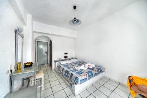 Postel nebo postele na pokoji v ubytování Hotel Iro