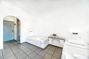 Postel nebo postele na pokoji v ubytování Hotel Iro