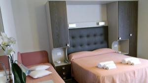 Postel nebo postele na pokoji v ubytování Hotel Parma Mare