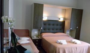 Postel nebo postele na pokoji v ubytování Hotel Parma Mare