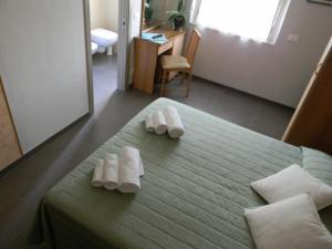 Postel nebo postele na pokoji v ubytování Hotel Parma Mare