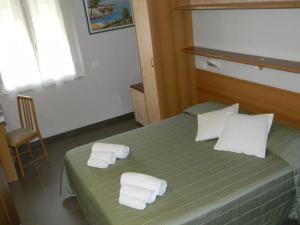 Postel nebo postele na pokoji v ubytování Hotel Parma Mare