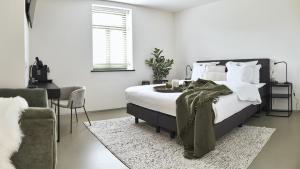 Postel nebo postele na pokoji v ubytování B&B Vossebergen Hombeek