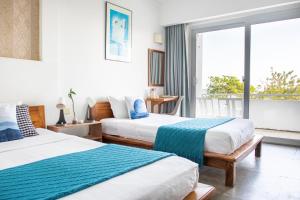 Postel nebo postele na pokoji v ubytování Saravoan-Kep Hotel + 37 fotografií
