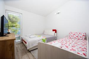 Postel nebo postele na pokoji v ubytování Lana