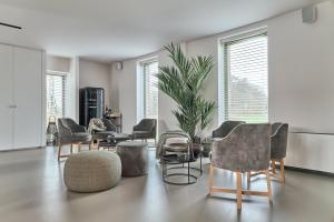 Posezení v ubytování B&B Vossebergen Hombeek