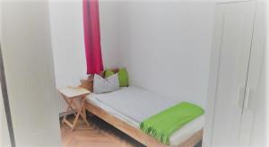 Łóżko lub łóżka w pokoju w obiekcie City-Apartments Langegger
