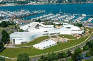 an aerial view of a large white building near the water at APPARTEMENT T2 RIVE DROITE in Brest