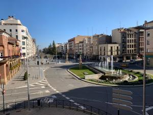 a city with a fountain in the middle of a street at Calahorra Centro in Calahorra +22 photos