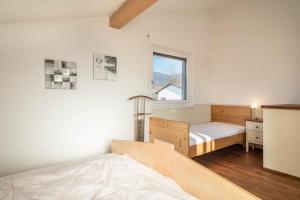 a bedroom with a bed and a window at Kilian in Schwarzach