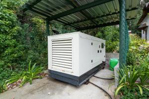 a large white appliance sitting under a roof at Plotsklaps Self Catering Cottage in Tokai
