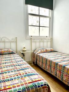 מיטה או מיטות בחדר ב-Toscal Nest
