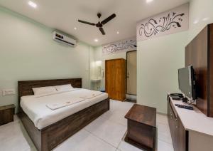 Ένα ή περισσότερα κρεβάτια σε δωμάτιο στο Hotel Saheb +20 φωτογραφίες